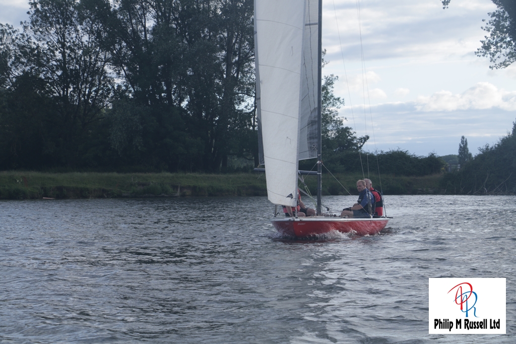 The A-Rater Sprinfrift with its distinctive red sides  approaching the camera boat