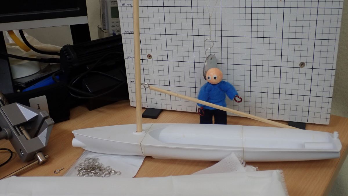 The 3-D boat  hull with its mast and boom