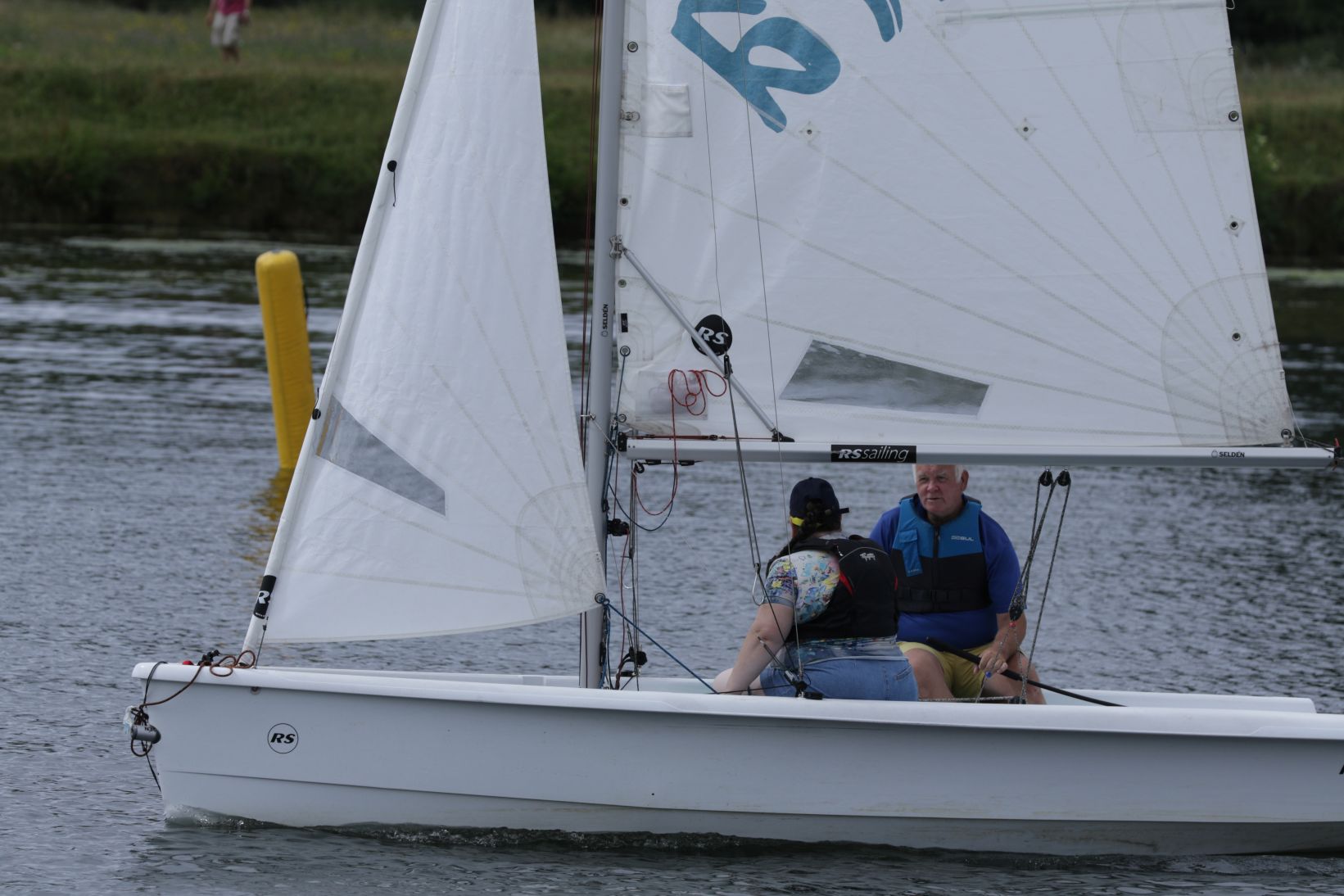 Ros and I sailing solo in the RS Toura having just had a lesson and being watched closely.