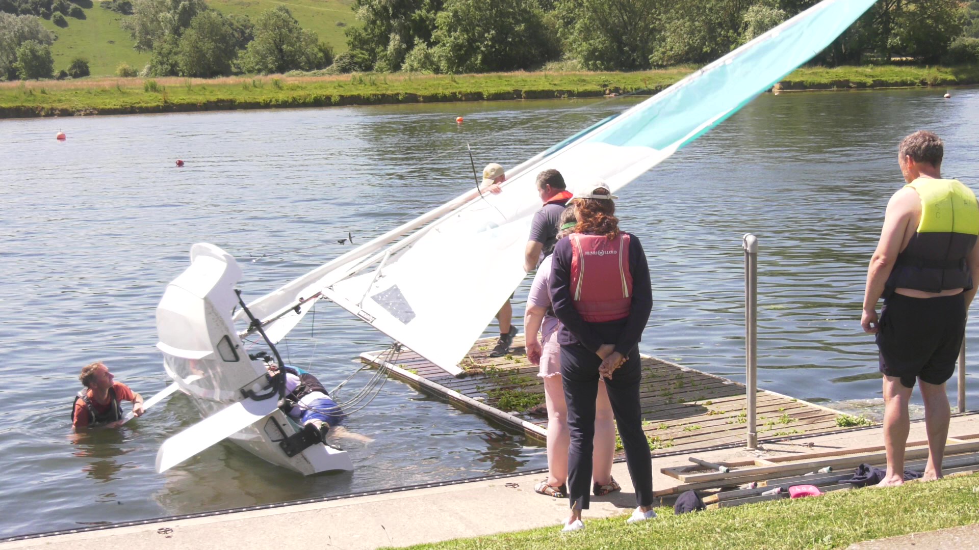 The Helm on the centreboard pushing down whilst the crew rolls into the dinghy