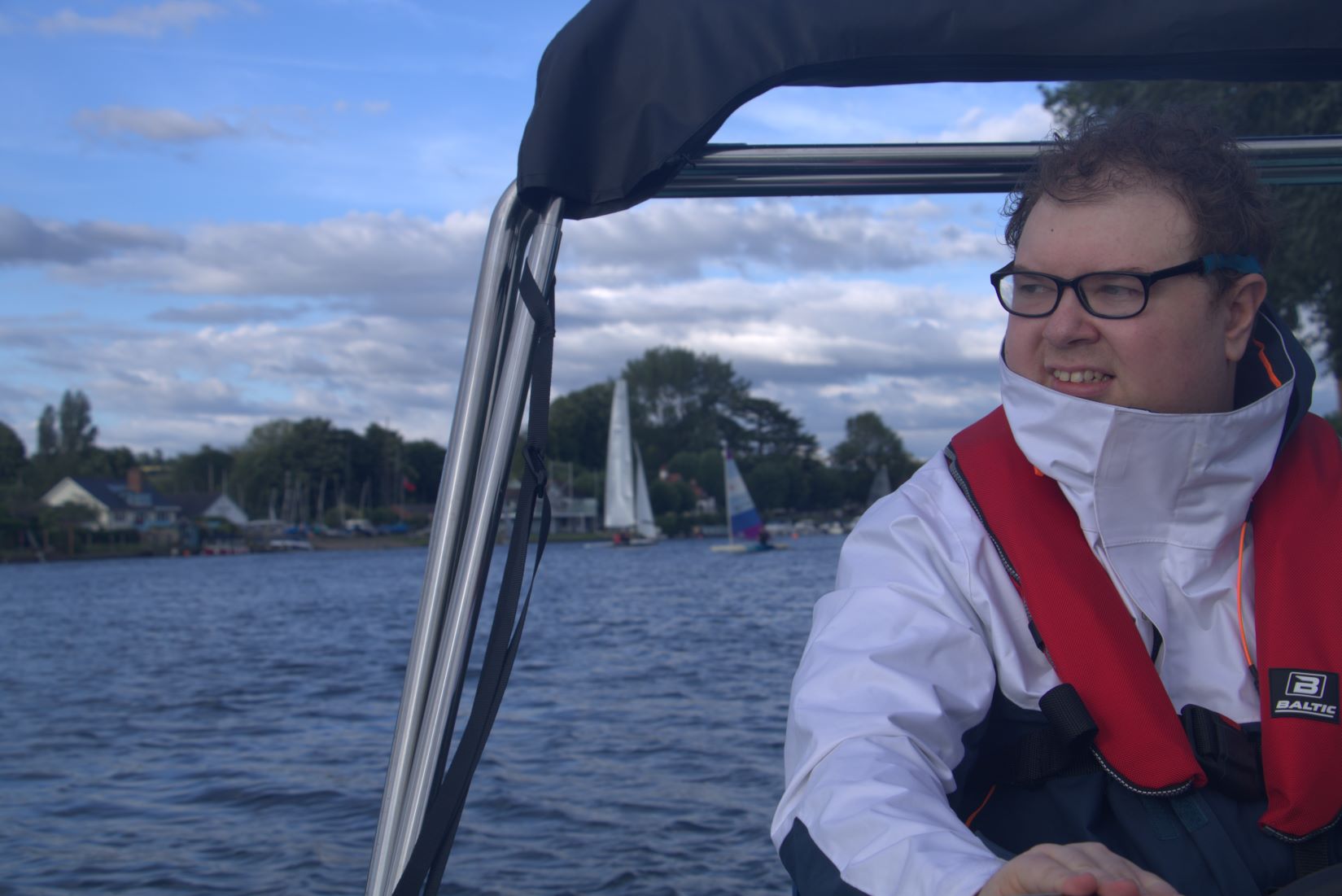 Mark off to the rescue checking around before accelerating to the capsized boat.