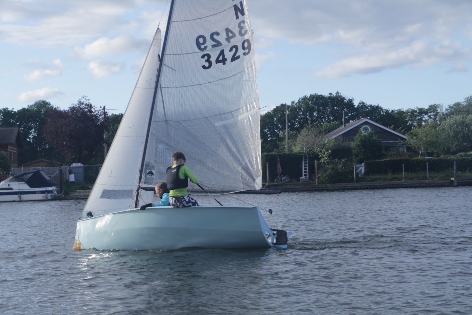 As the boat rights itself the crew try to roll into the boat