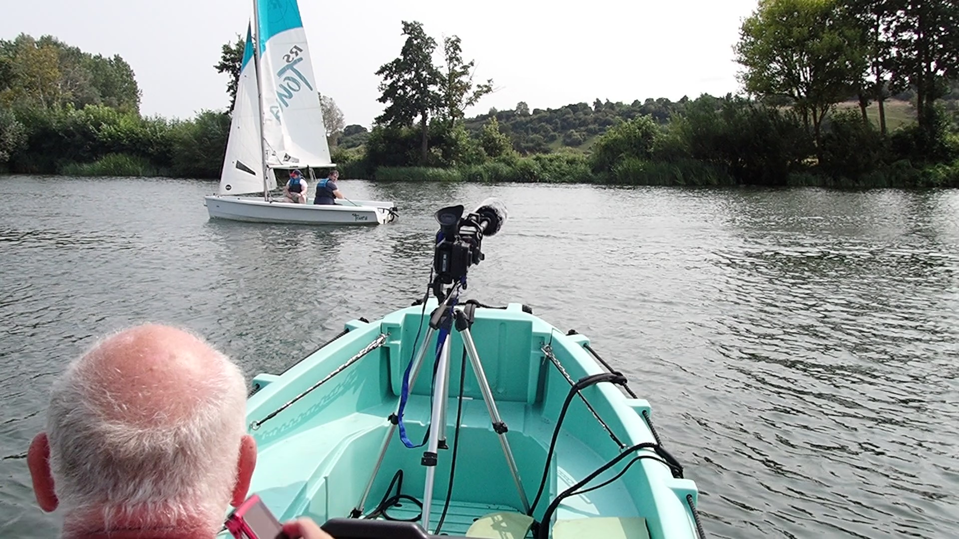Out in the camera boattaking some photos and video of my wife and son sailing