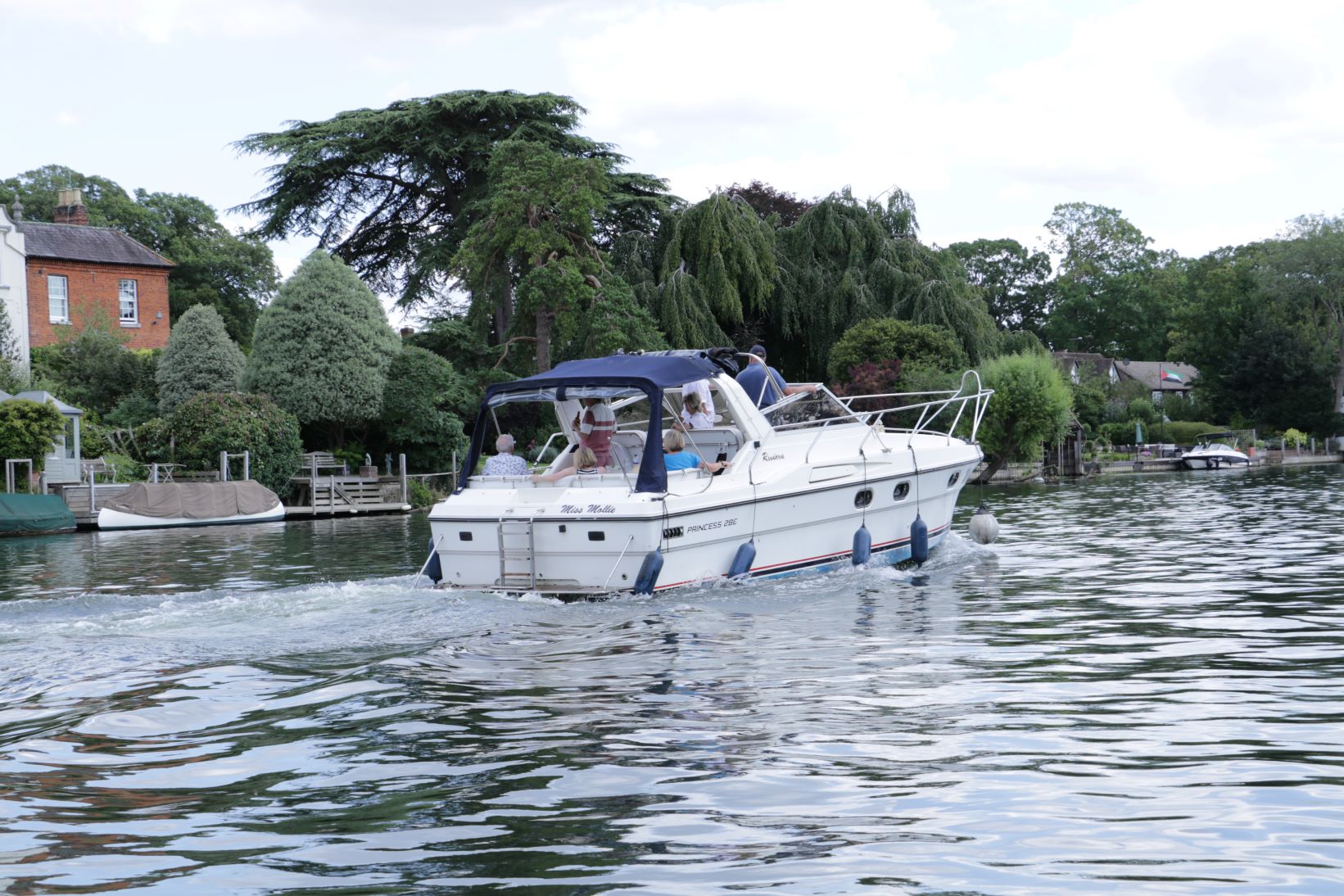 A motor cruser speeding past as we pootle along enjoying the day
